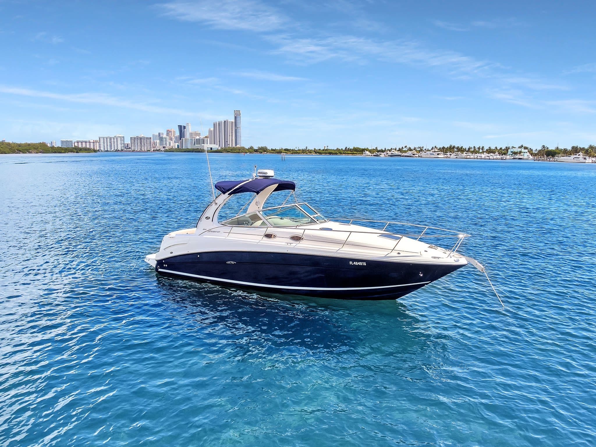 Bowrider speedboat anchored in clear blue Miami coastal waters