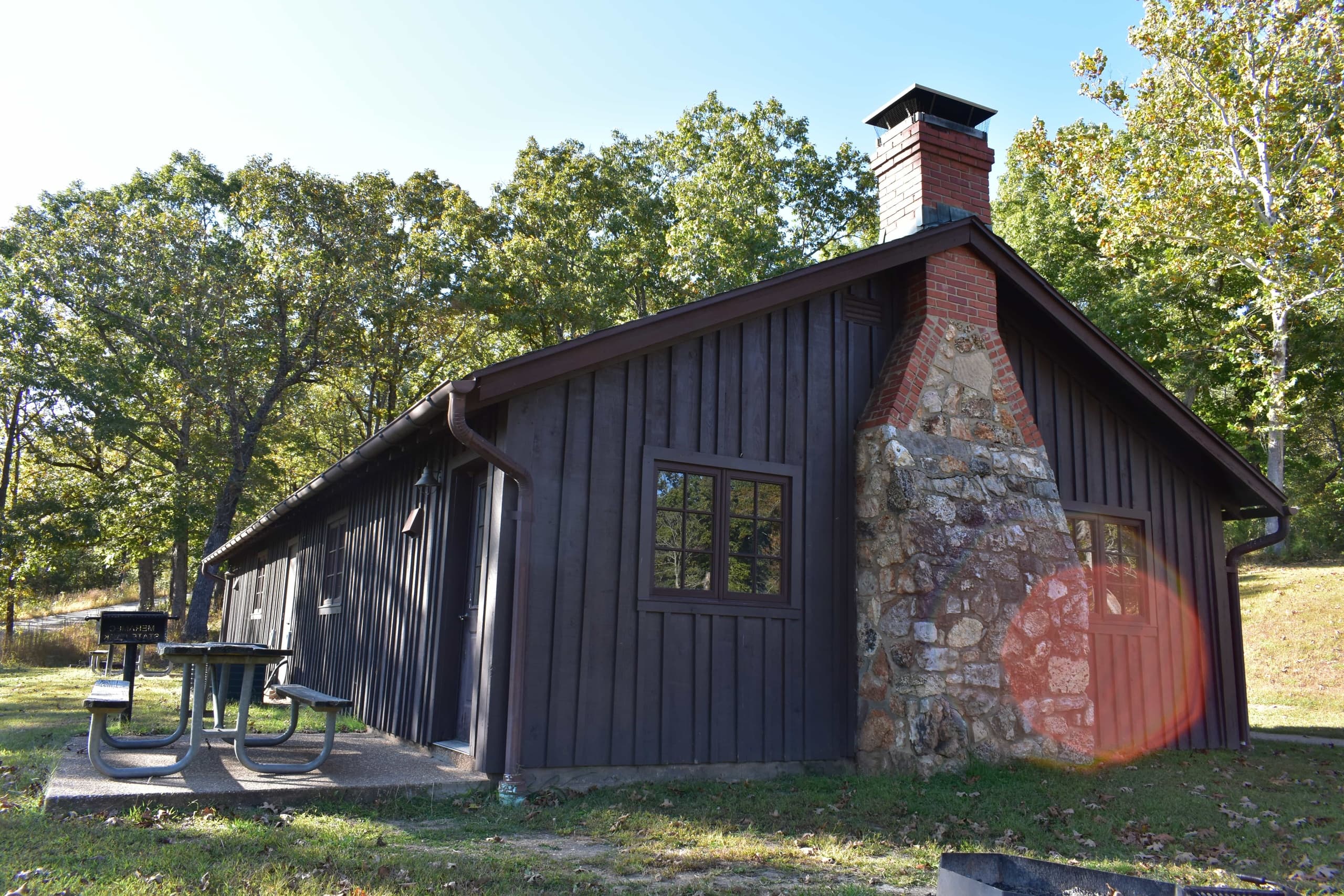 Rustic park lodge facade at Meramec Park surrounded by trees