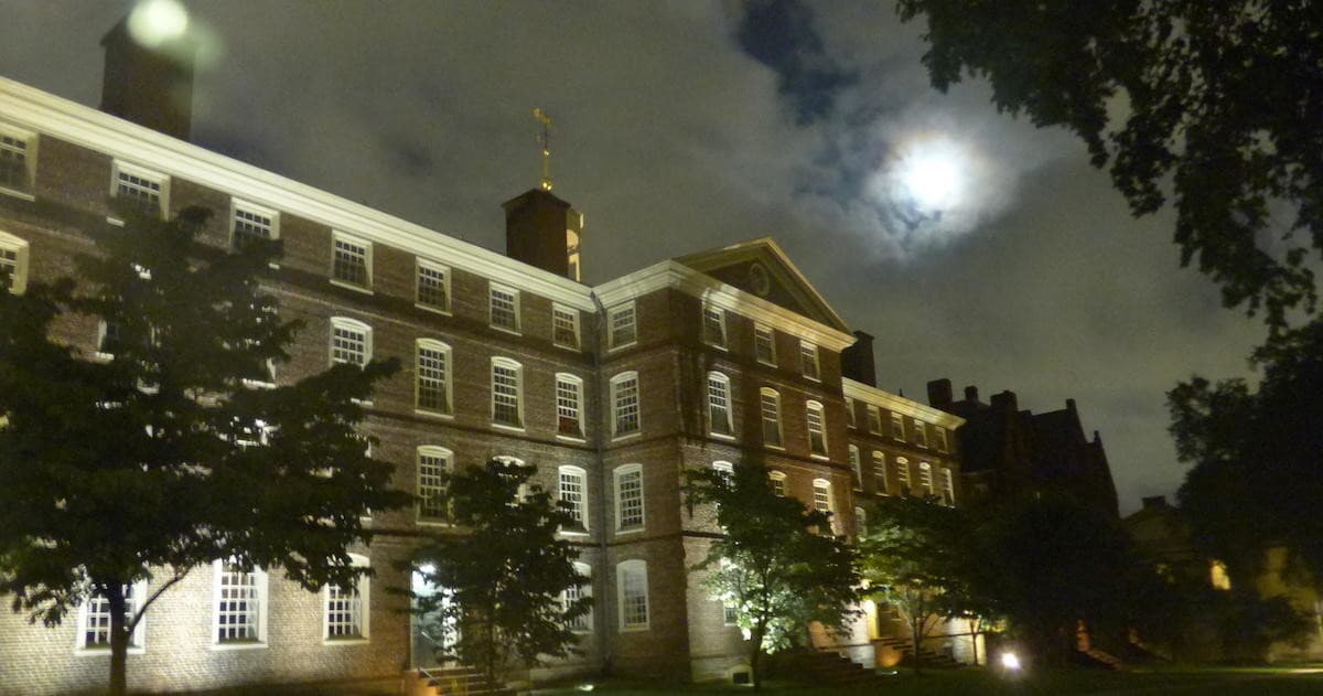 Historic Providence building lit by moonlight on nighttime tour