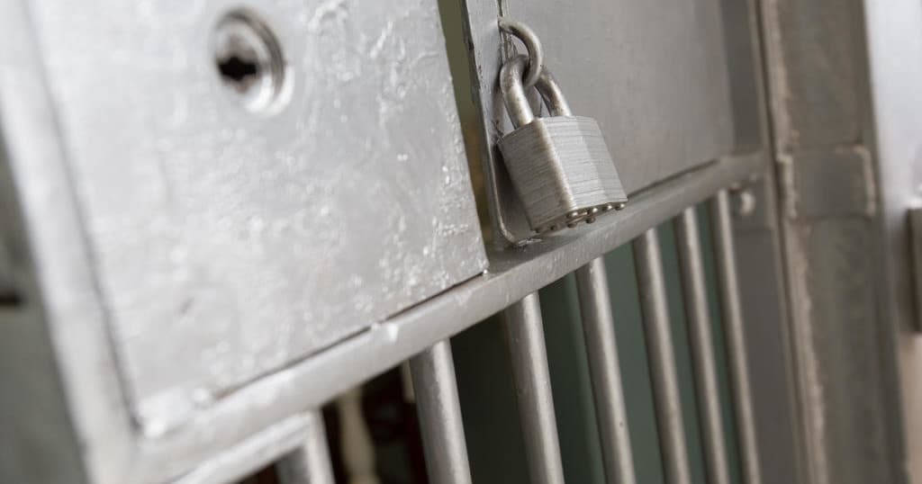 Detailed padlock and metal cell bars inside Colorado prison museum