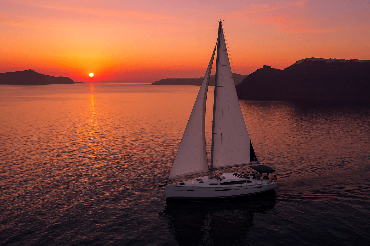 Sailboat at sunset over Santorini caldera waters, cruising