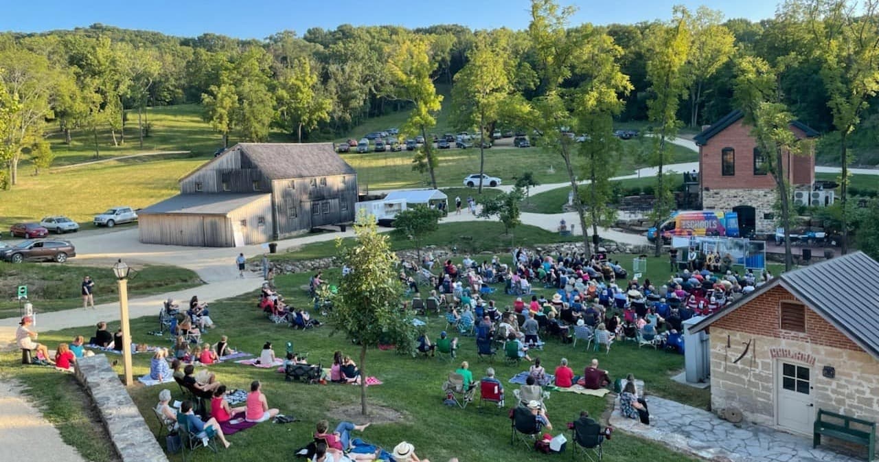 Outdoor festival crowd gathered on Hermann Farm lawn