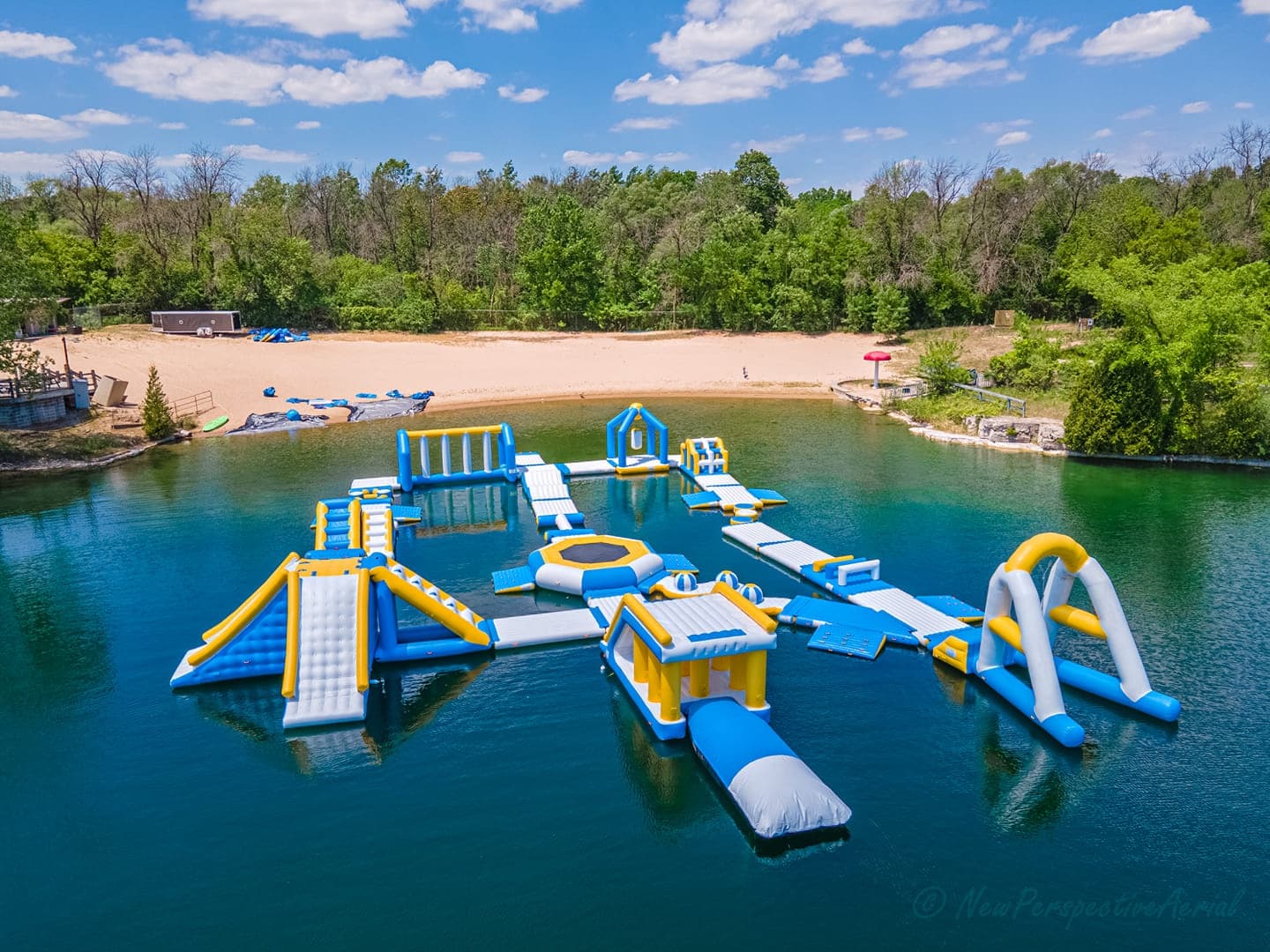 Aerial view of inflatable water park at Sheboygan quarry beach