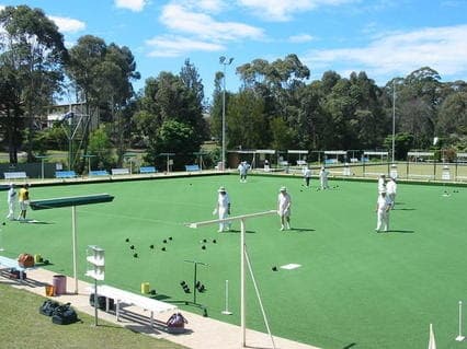 Lawn bowlers playing on a sunny green at Mollymook club