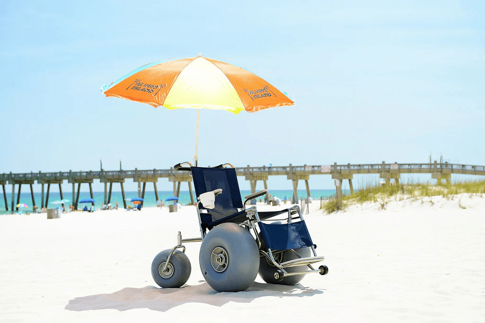 Beach umbrella and lounge chair on sunny Gulf Coast white sand