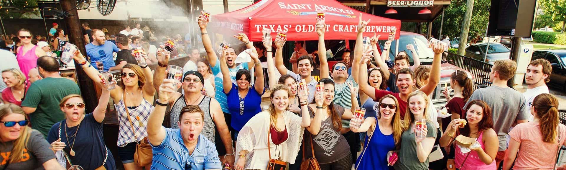 Crowd enjoying outdoor beer festival at Saint Arnold brewery event