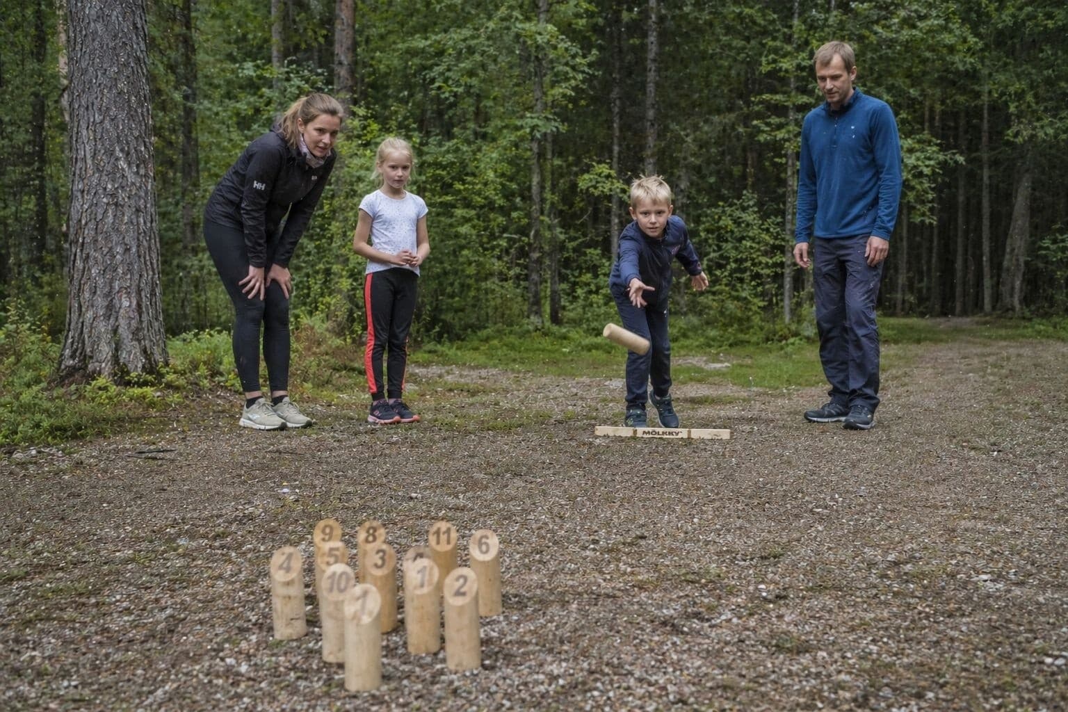 Family Summer Games in a Private Rovaniemi Forest: Mölkky, Volleyball & Campfire Snacks