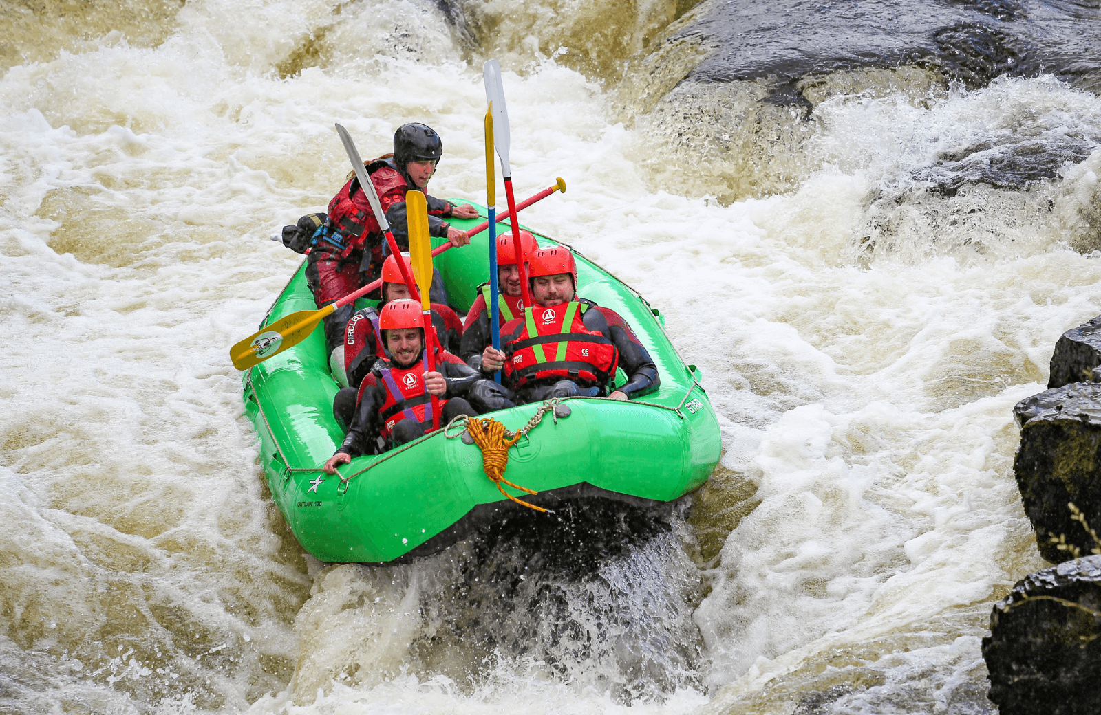 Exciting raft descent through churning river rapids, outdoors adventure