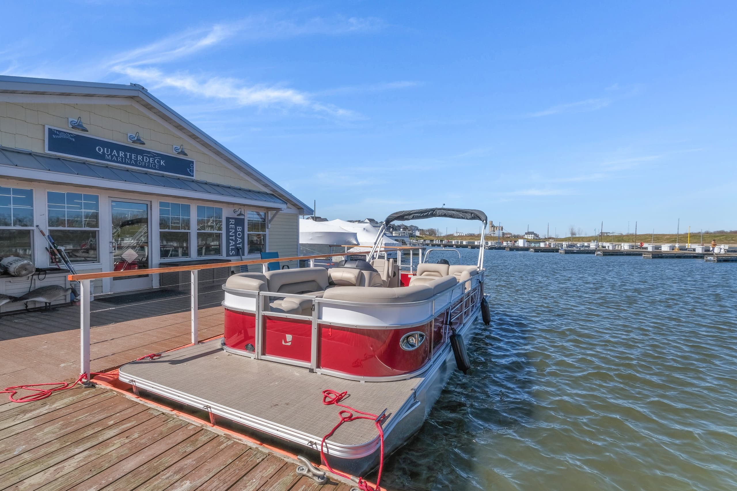 Pontoon rental tied to dock outside marina restaurant, Ottawa harbor