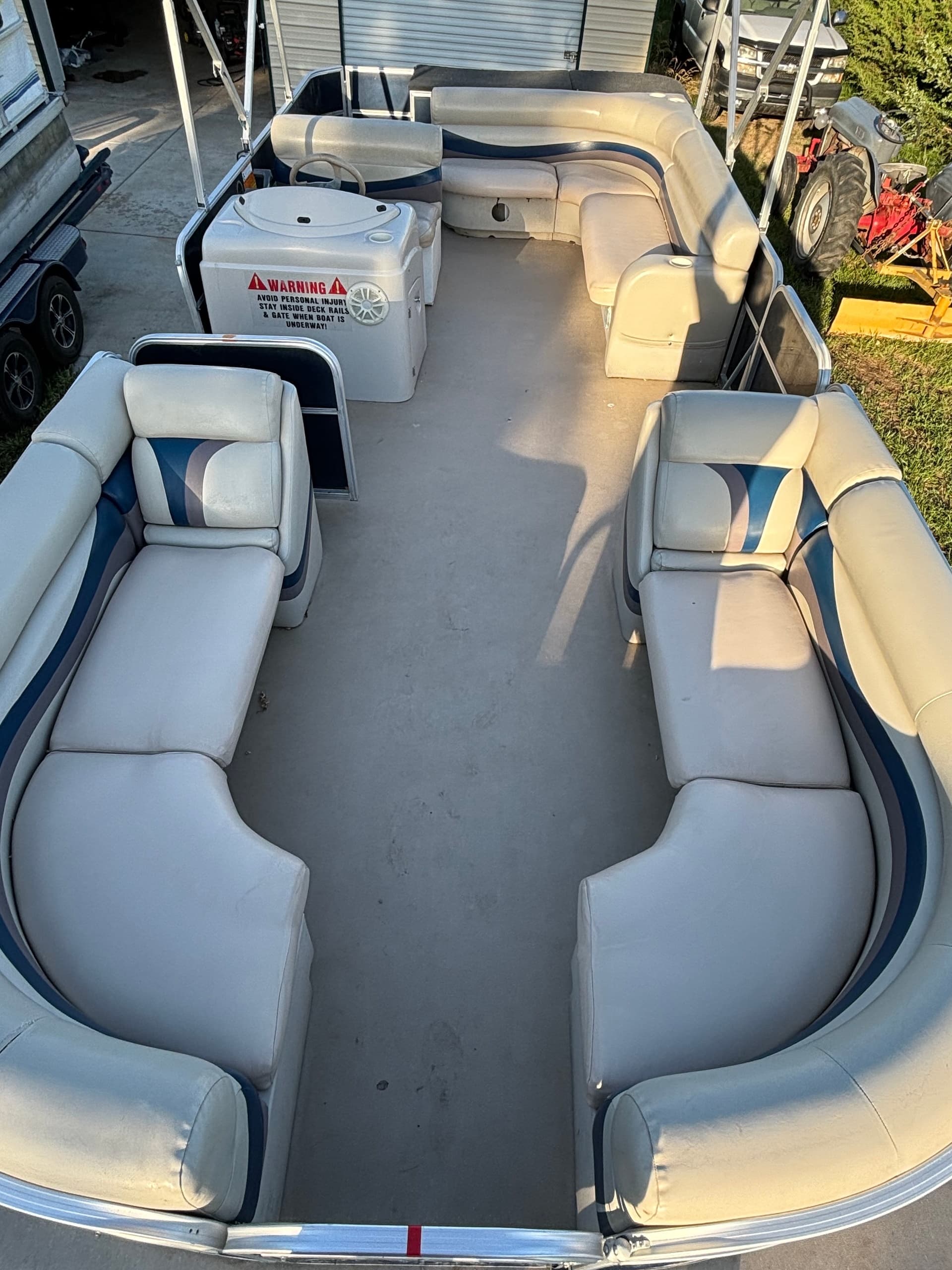 Pontoon interior seating layout with open center aisle for guests