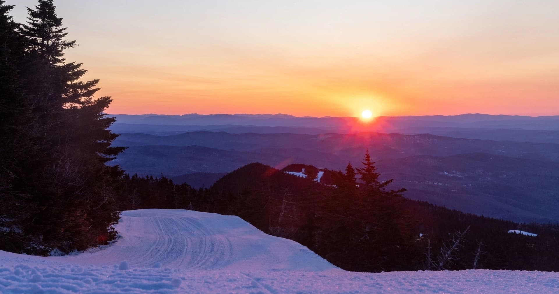 Sunset view over snowy Killington ski slopes and ridge