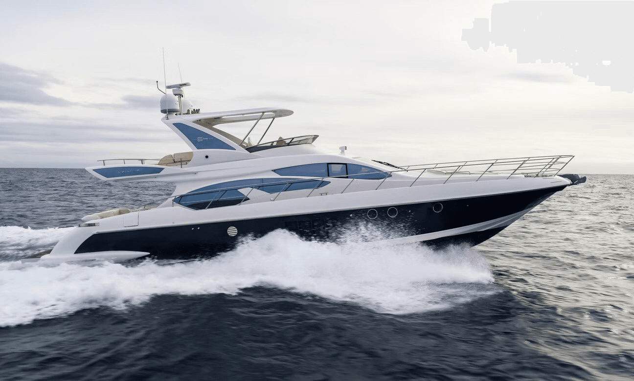 Bow view of luxury yacht approaching tropical island shoreline