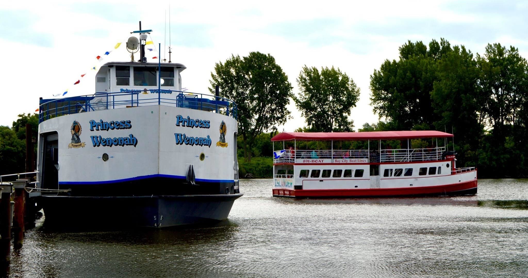 Ferry bow approaching harbor on daytime scenic river cruise