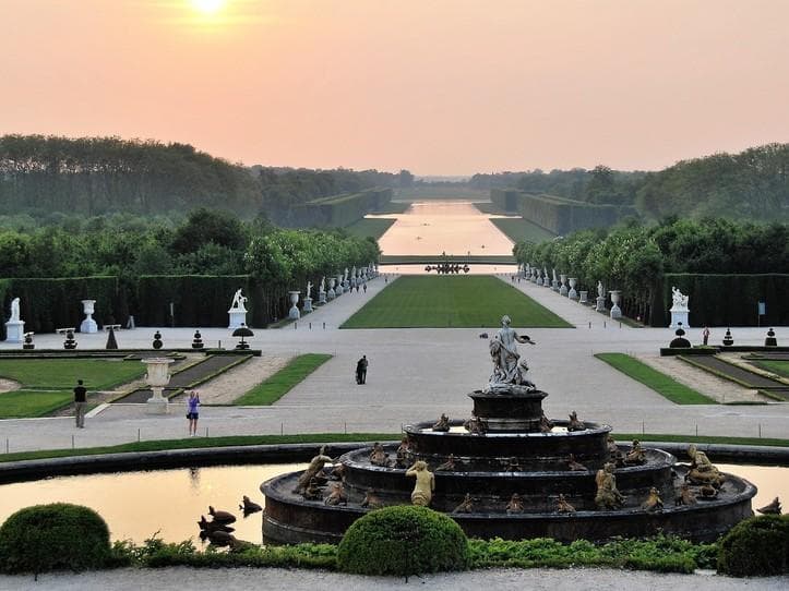 Sunrise view down Versailles grand canal gardens, France