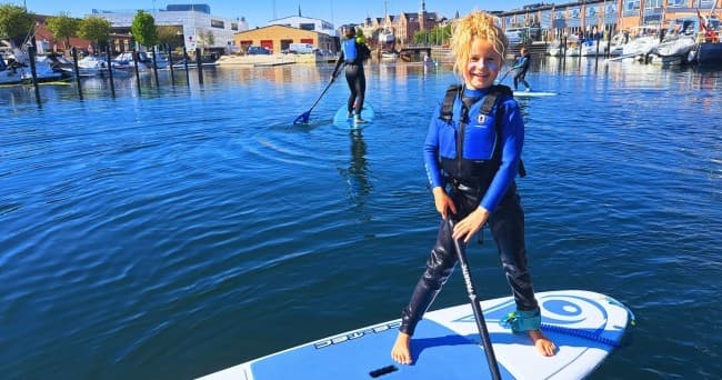 Family Stand-Up Paddleboarding at Surf Agency