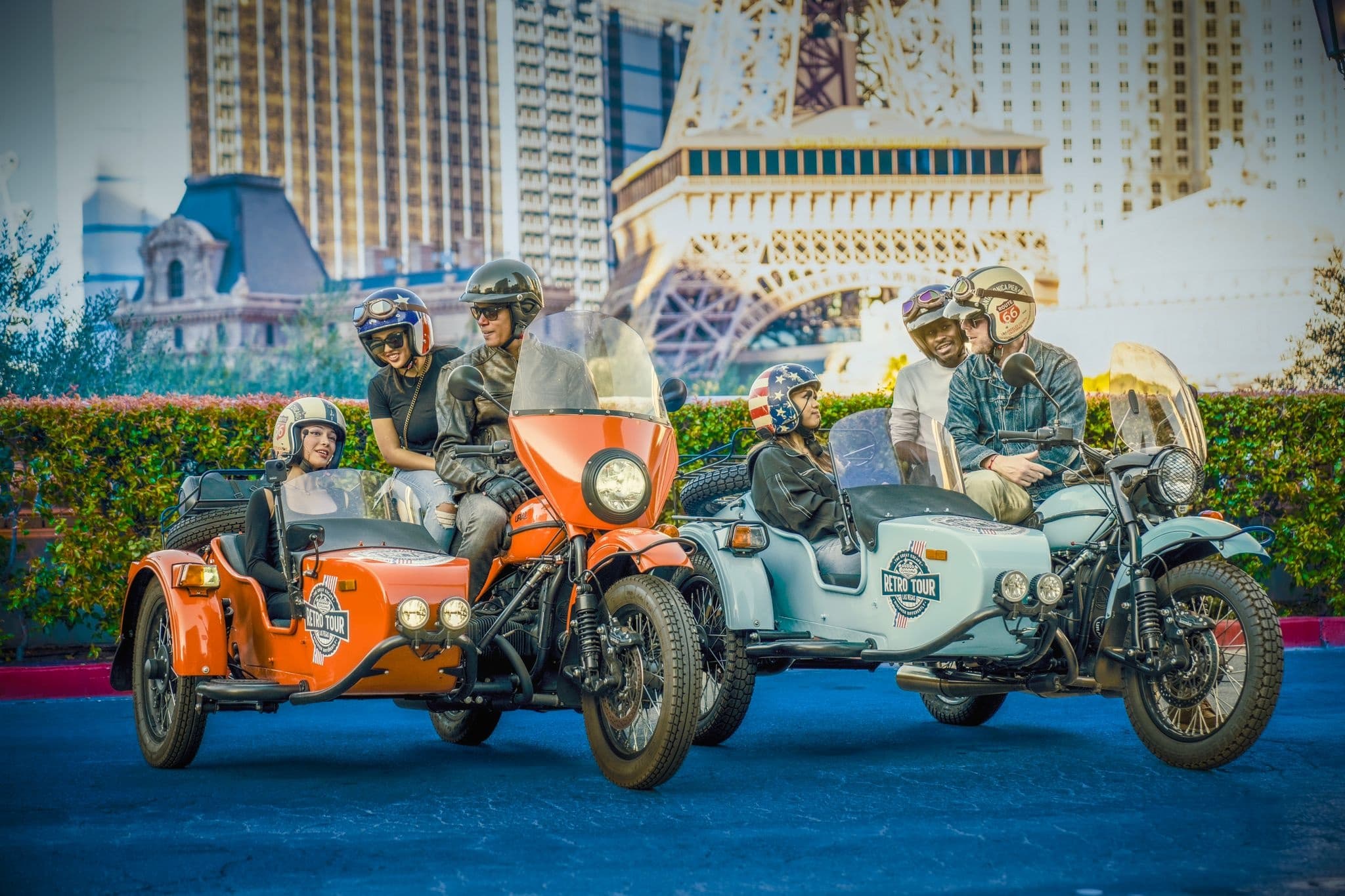 Retro sidecar motorcycles parked near iconic Vegas hotel on tour