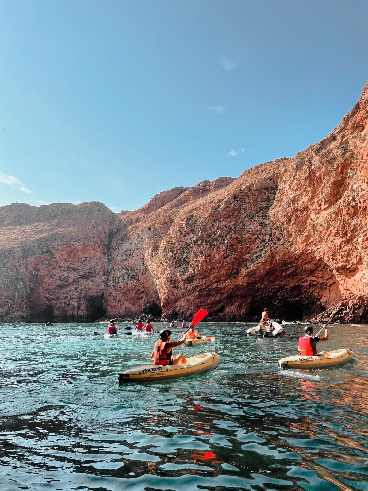 Kayakers paddling in sea caves and cliffs near Berlenga Island