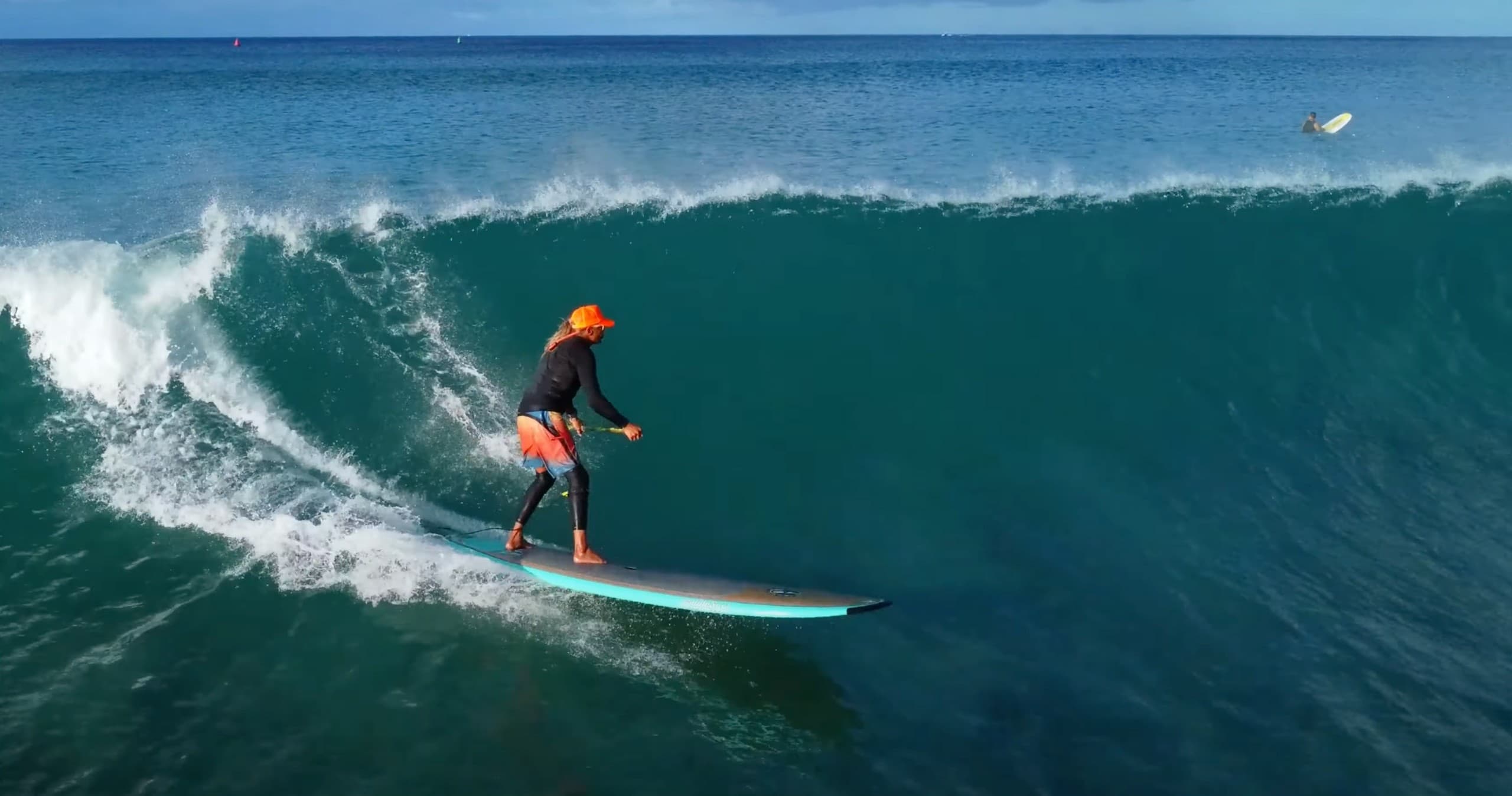 Surfer carving a large wave off Honolulu coastline in Hawaii