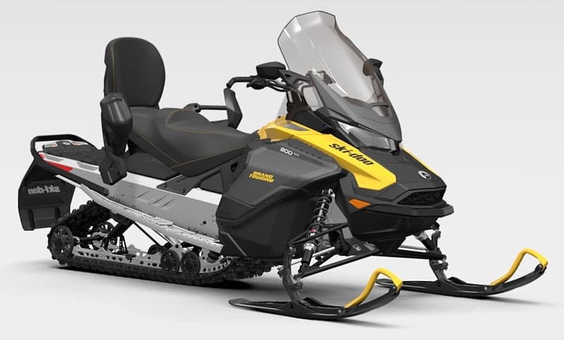 Two-up snowmobile ready for trail riding in alpine terrain