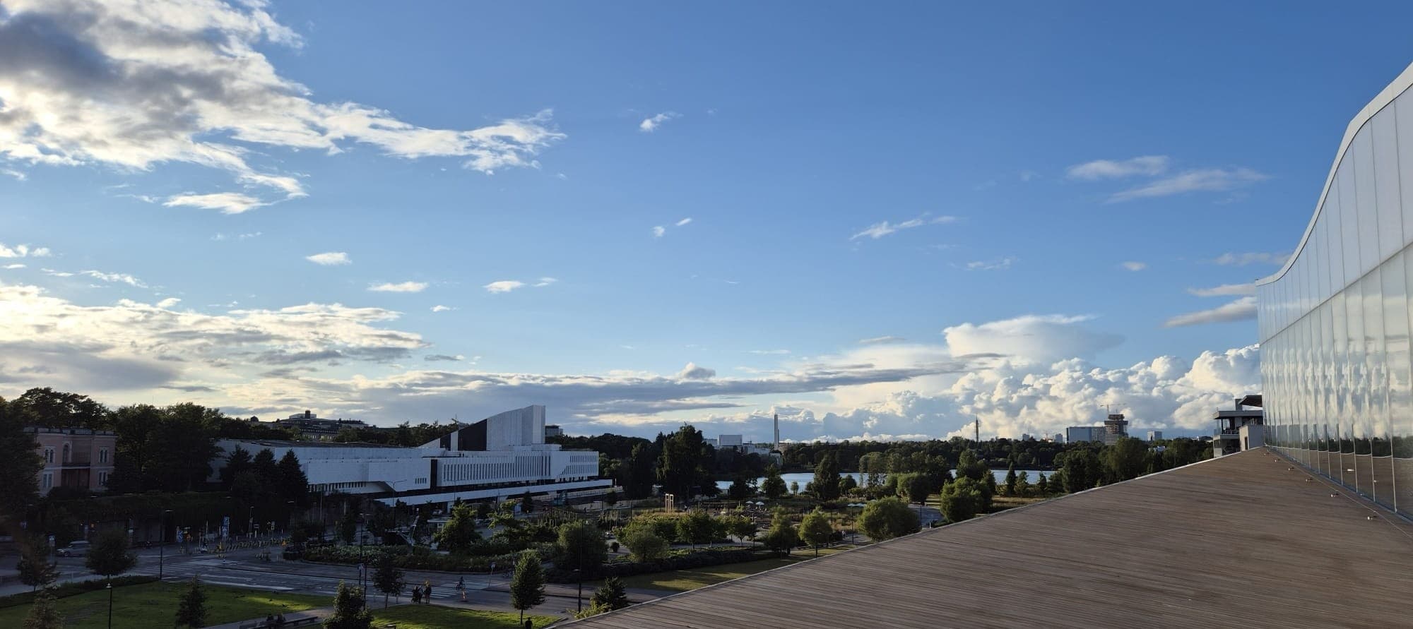 Panoramic harbor skyline from Helsinki rooftop at golden hour