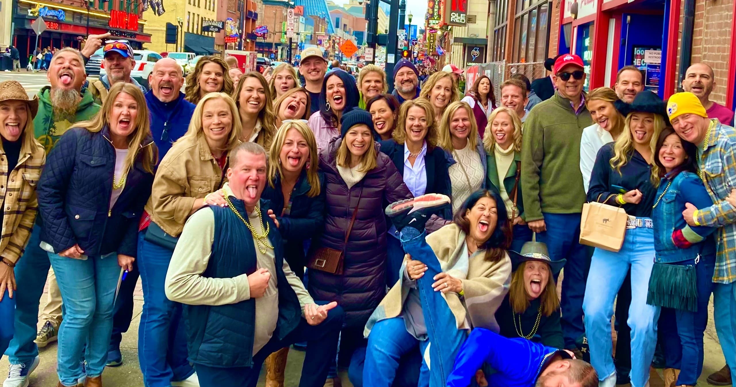 Large group on colorful Nashville alley during pub crawl tour