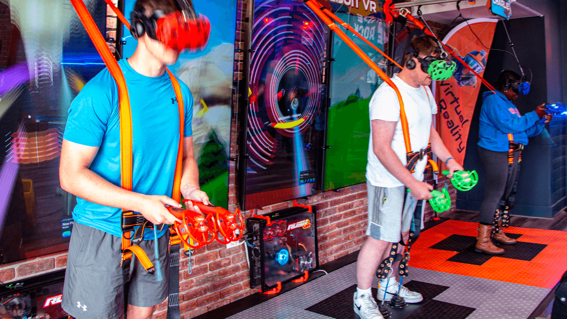 Players in neon VR arcade wearing headsets for immersive gaming