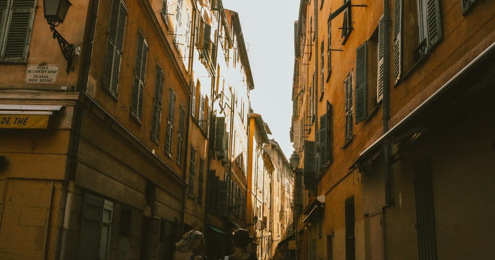 Narrow historic alleyway in Mediterranean old town, walking tour