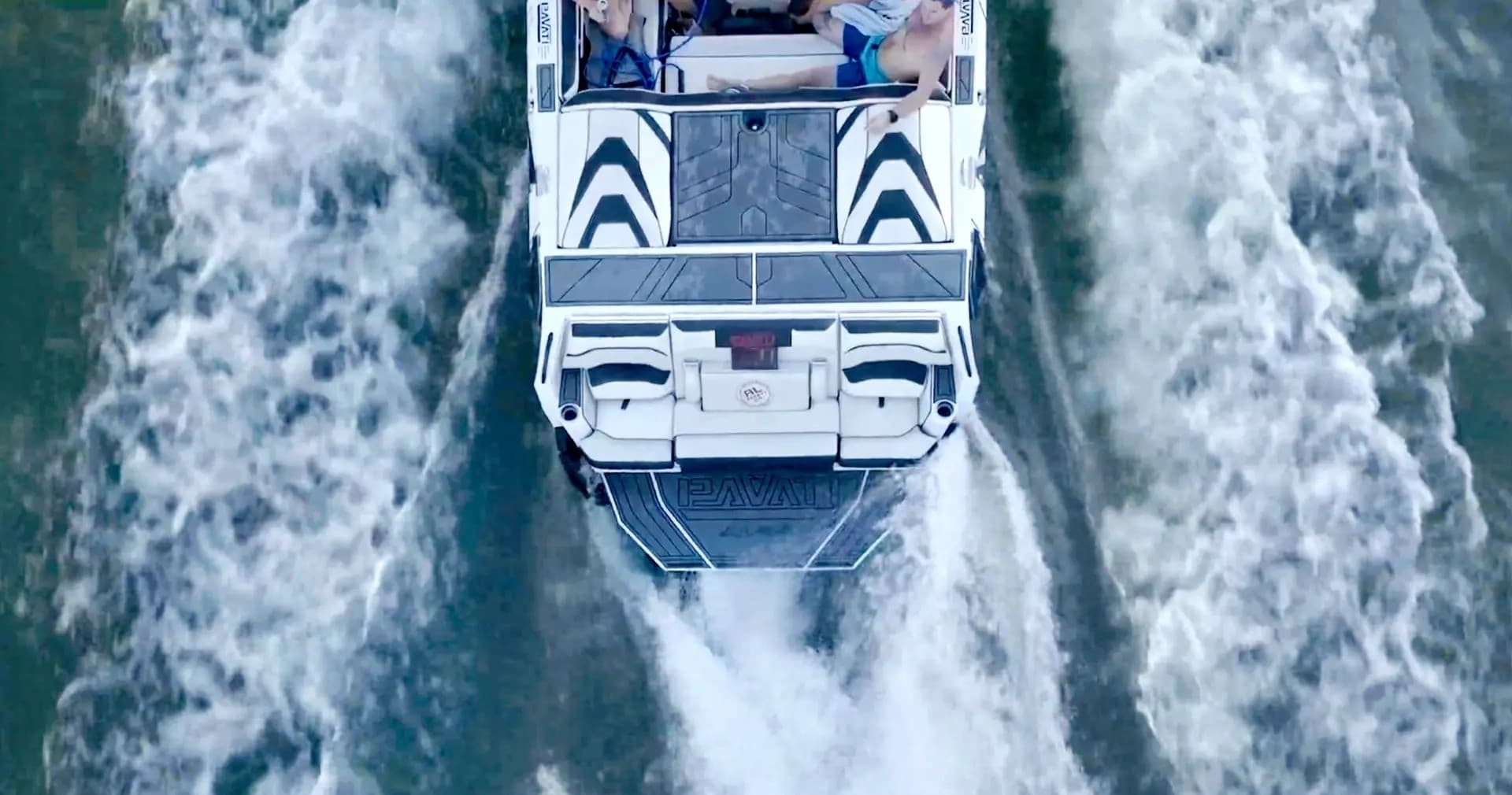 Aerial shot of wake trailing high-performance boat on lake