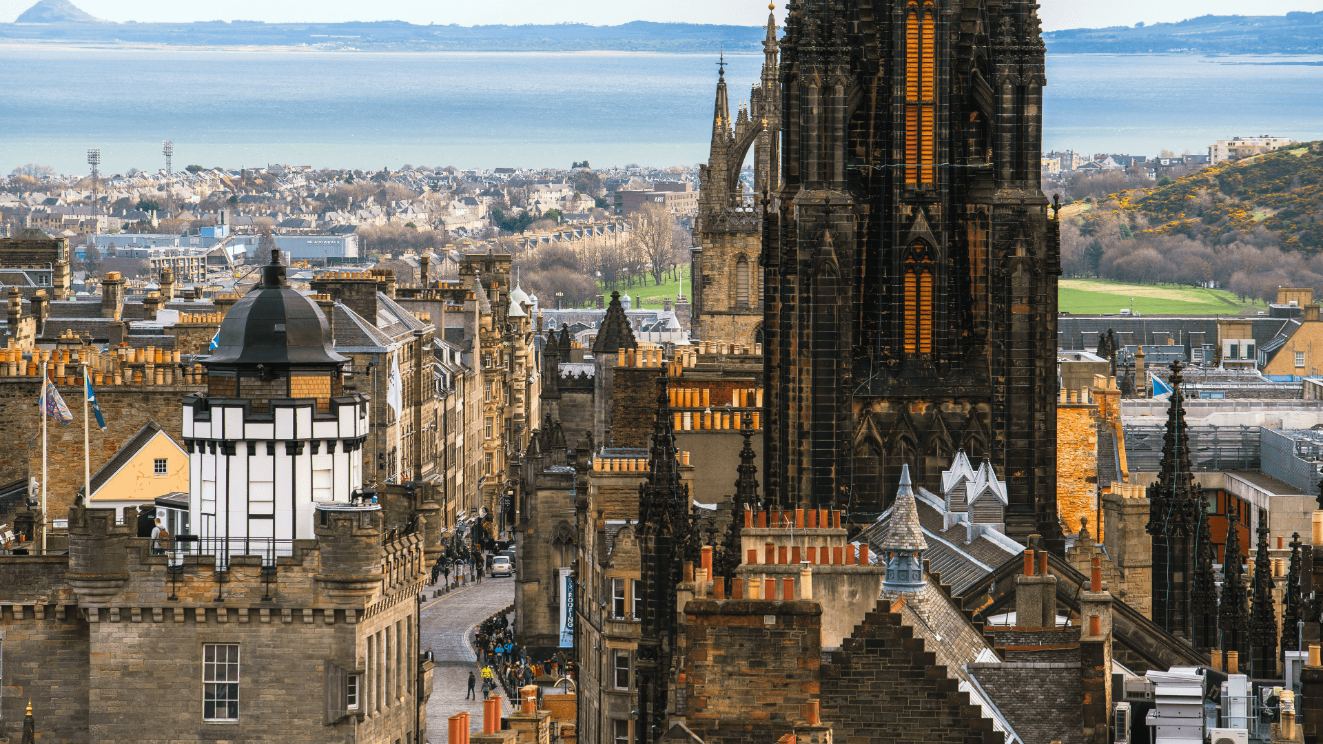 Panoramic Edinburgh skyline with historic cathedral and rooftops