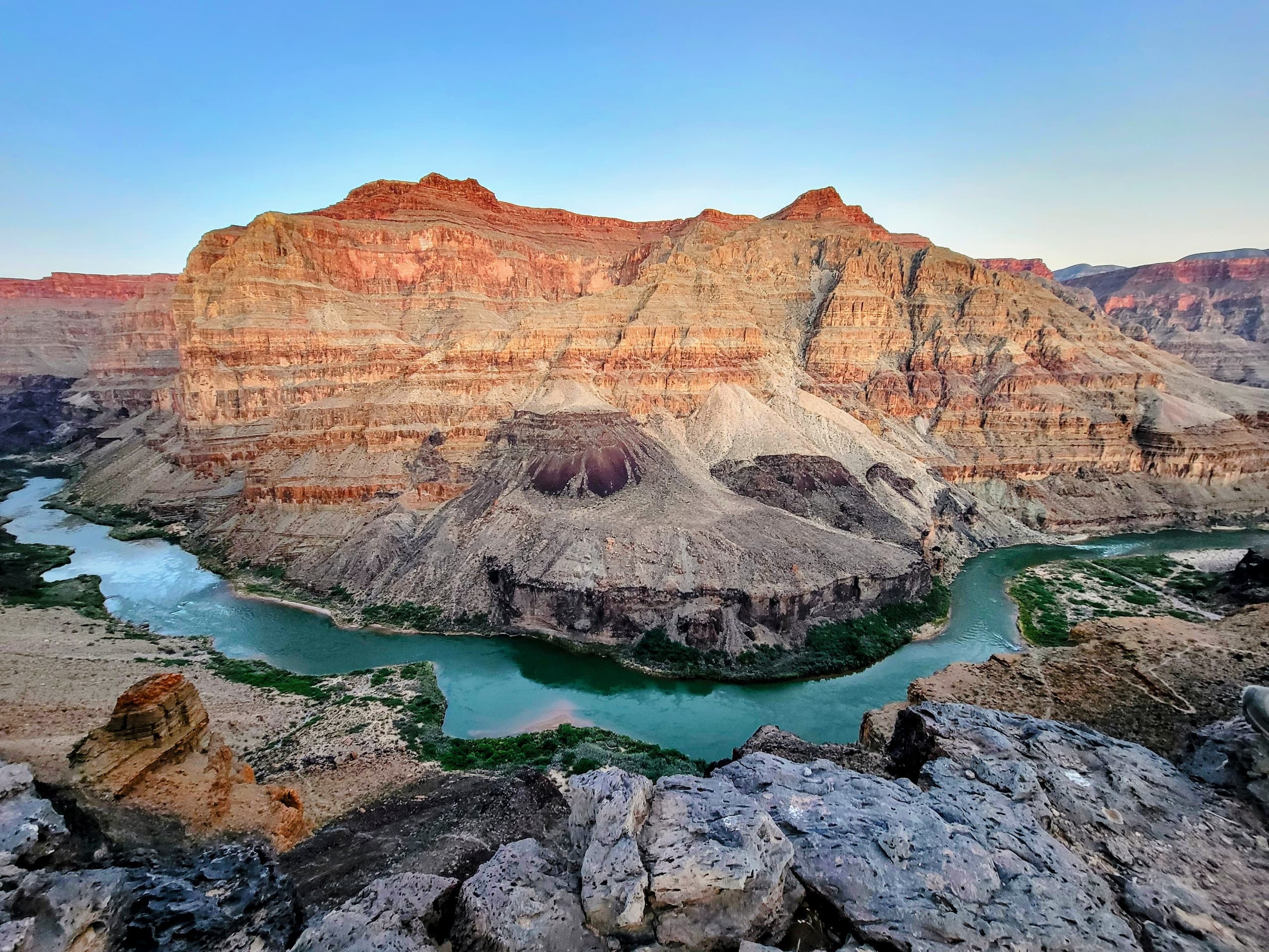 Panoramic desert canyon with river and scenic UTV route