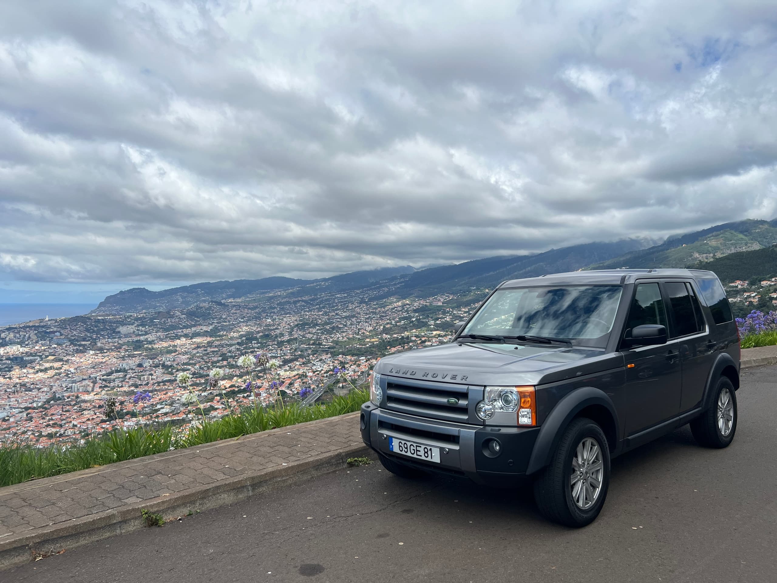 4x4 overlooking Funchal city and Atlantic from mountain viewpoint