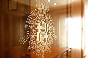 Etched glass door with crest displayed in indoor boutique showroom