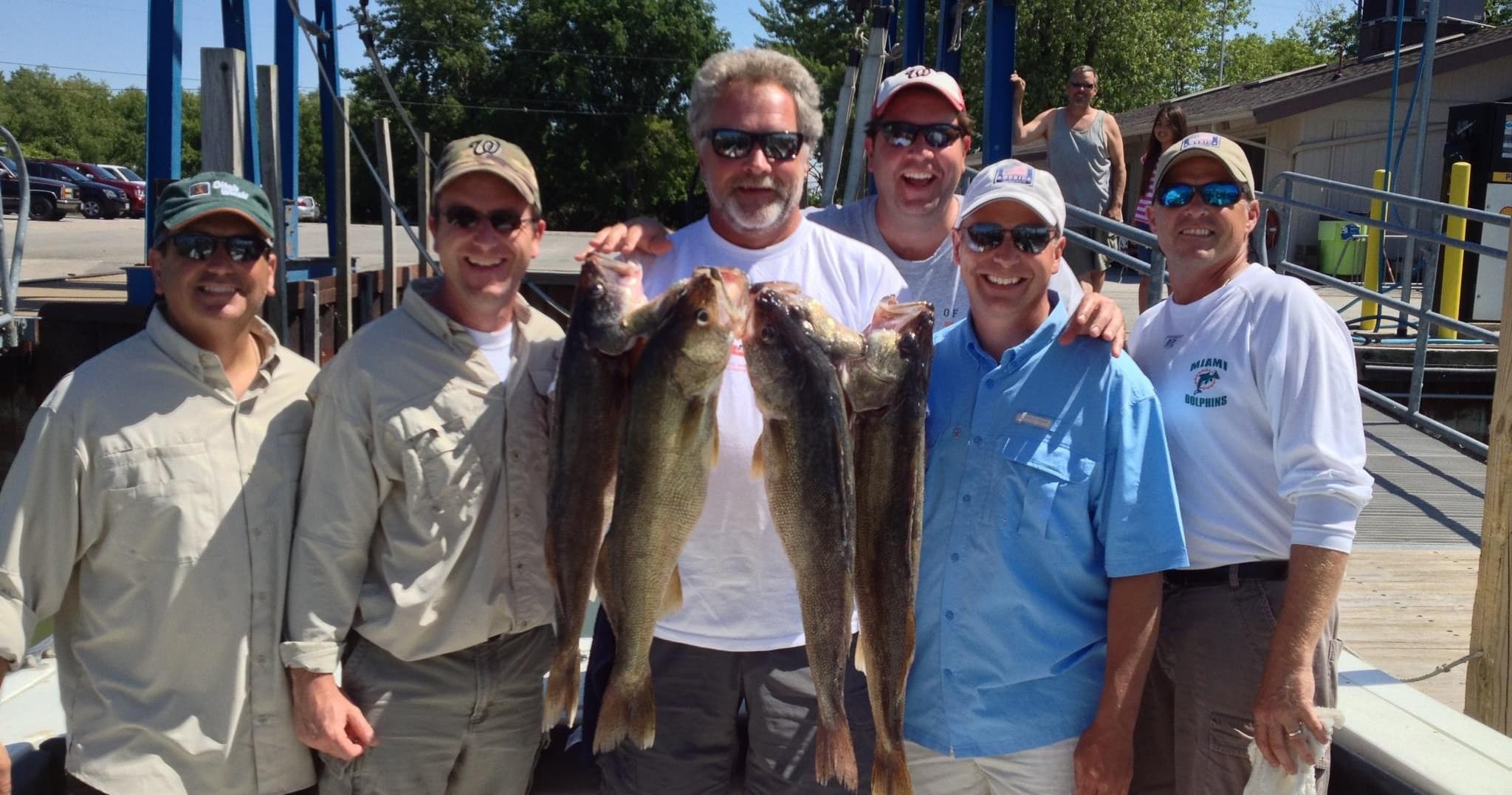 Dockside Lake Erie walleye charter, anglers showing large fish