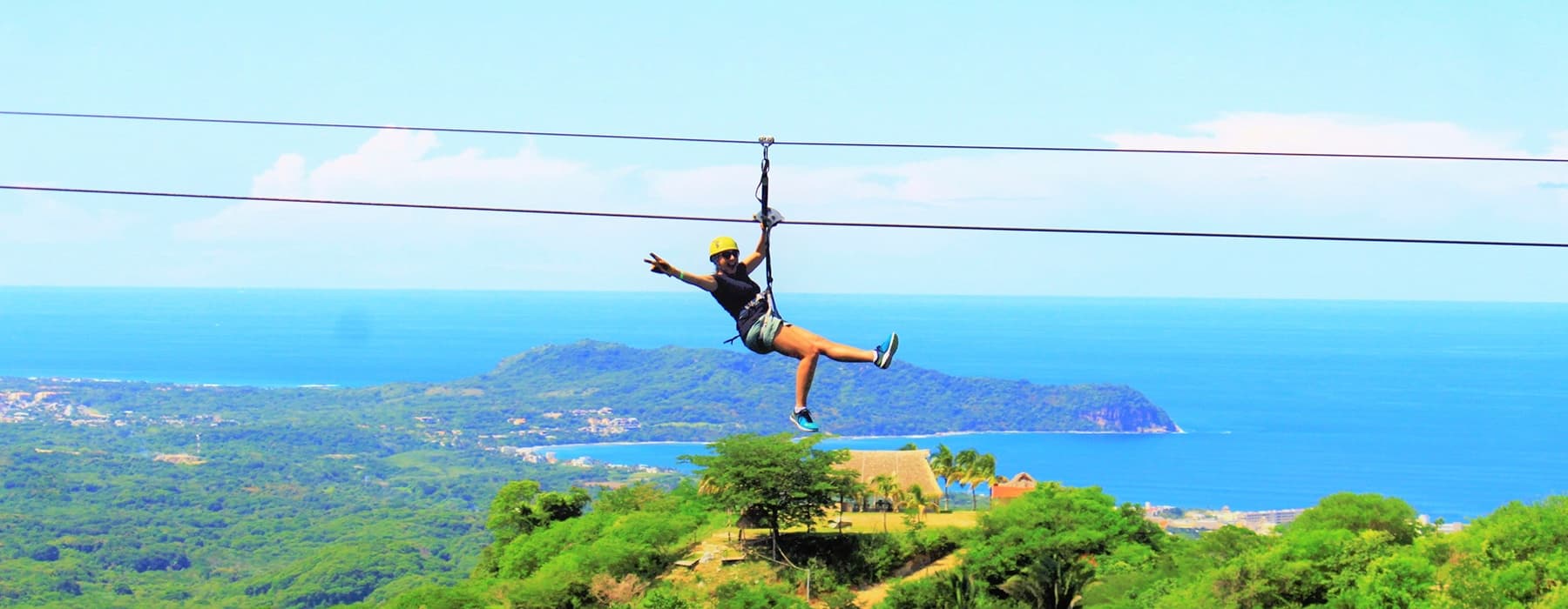 Coastal zipline over ocean with panoramic seaside views