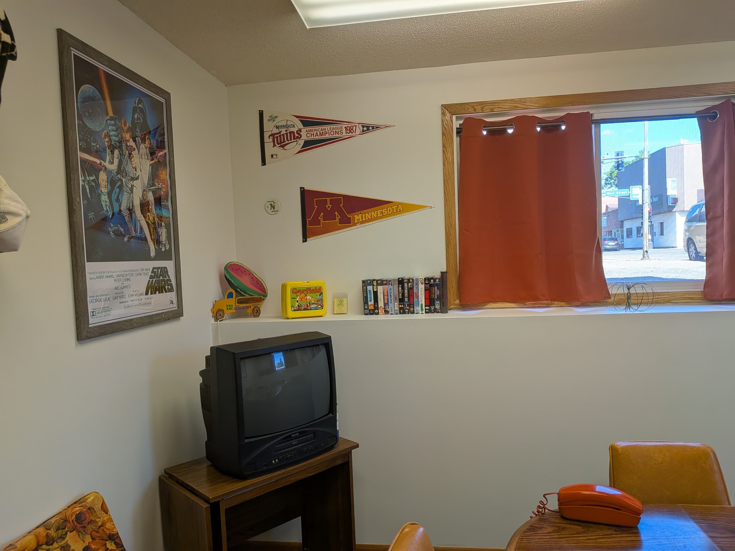 Retro playroom nook with TV and window for small gatherings