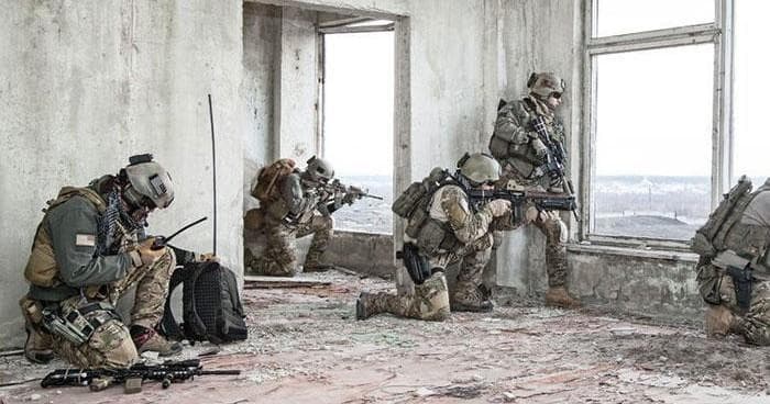 Tactical team training in abandoned urban ruin, outdoor-urban combat