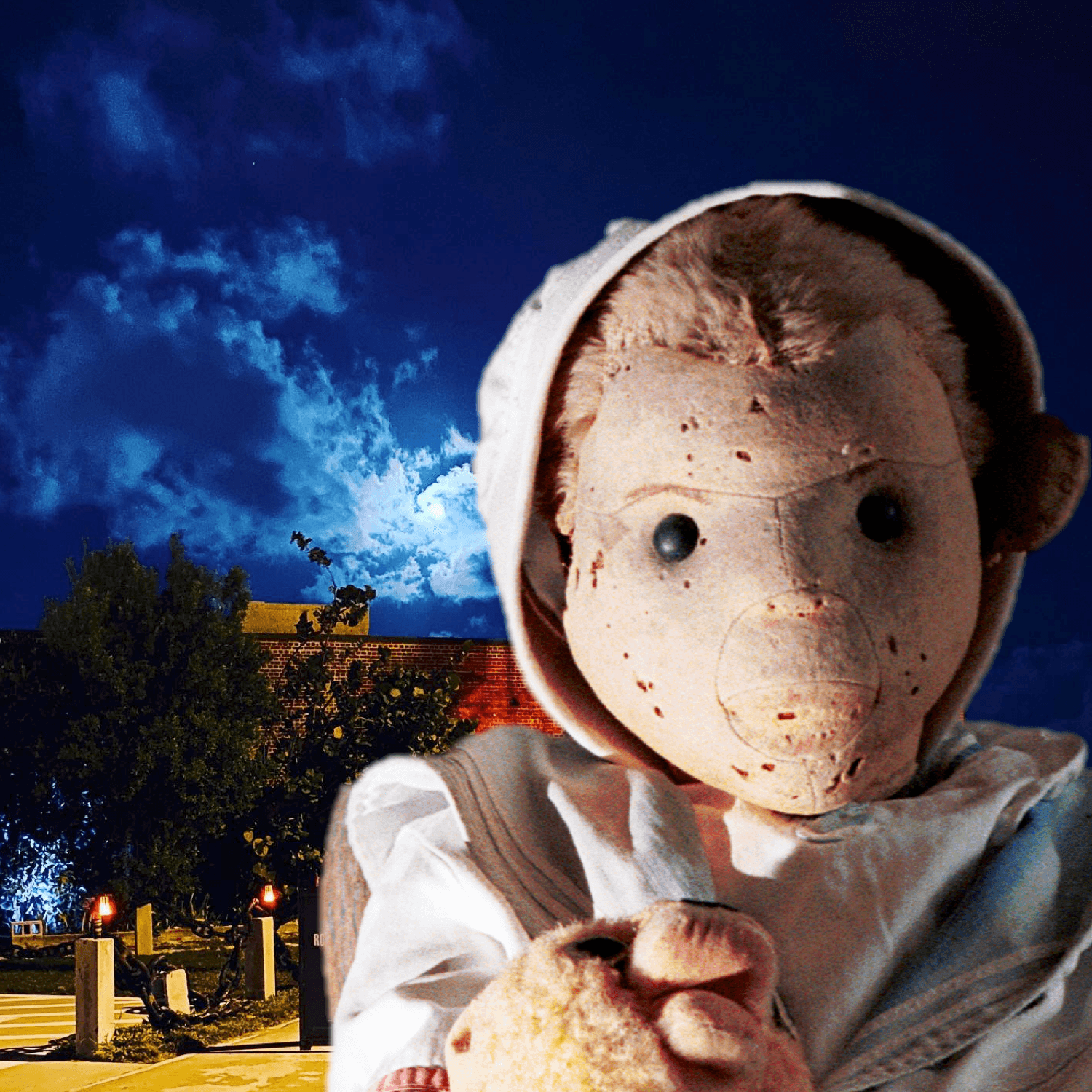 Creepy doll in moonlit cemetery square at night, eerie close-up