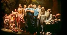Group of historical figures tableau in dimly lit museum exhibit