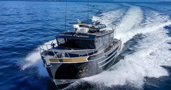 High-speed sportfishing yacht slicing ocean waves