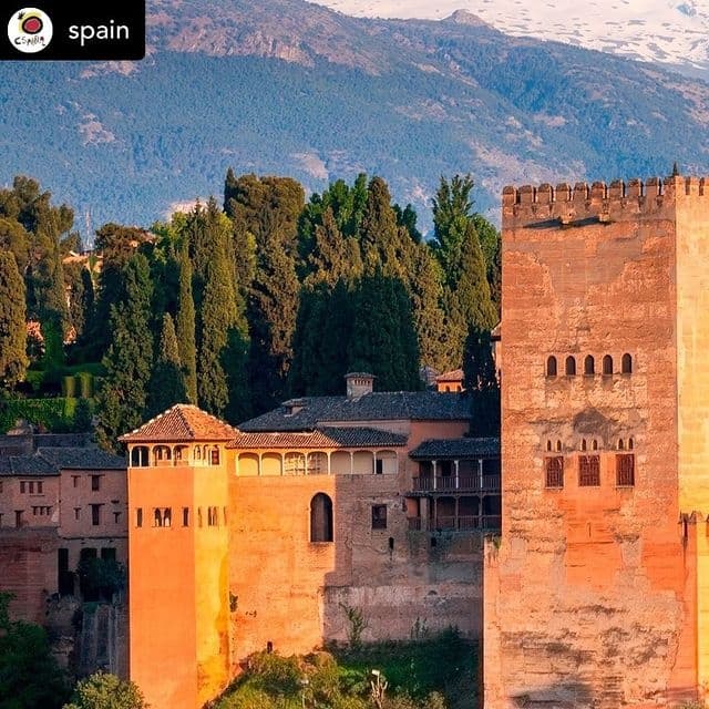 Scenic Alhambra fortress towers in Granada at sunset, historic tour