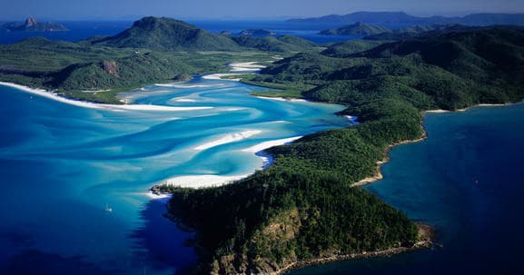 Aerial view of winding white sand inlet and tropical islands