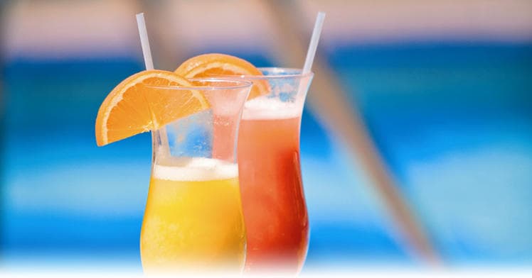 Tropical poolside cocktails by the ocean for vacation drinks