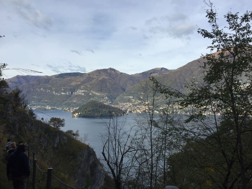 Couple on viewpoint overlooking Lake Como, scenic lookout