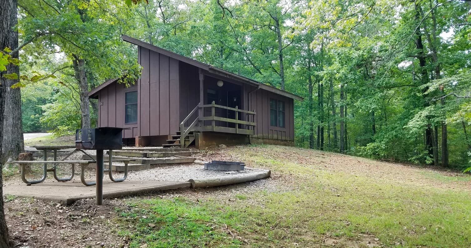 Elevated cabin with picnic table and firepit, family campsite