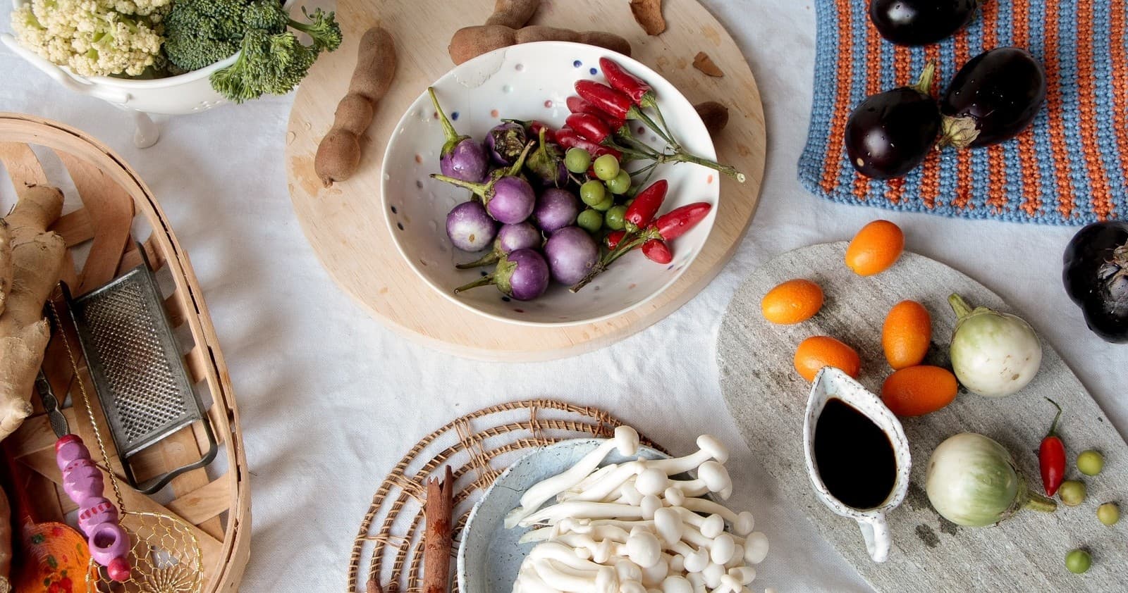 Variety of fresh vegetables and mushrooms on kitchen counter
