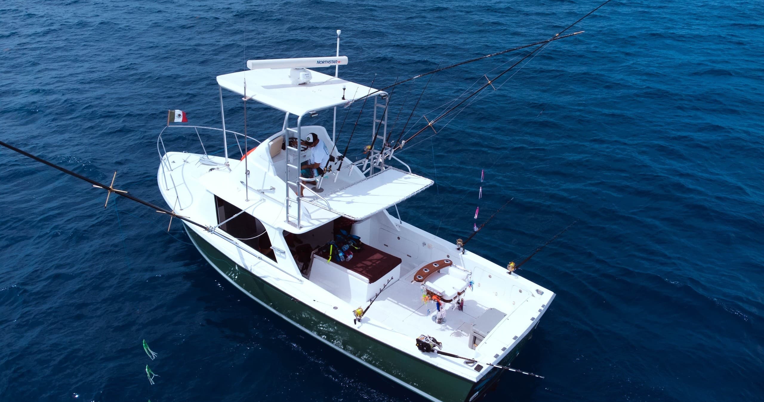 Sport fishing yacht on deep blue Caribbean waters near Cozumel
