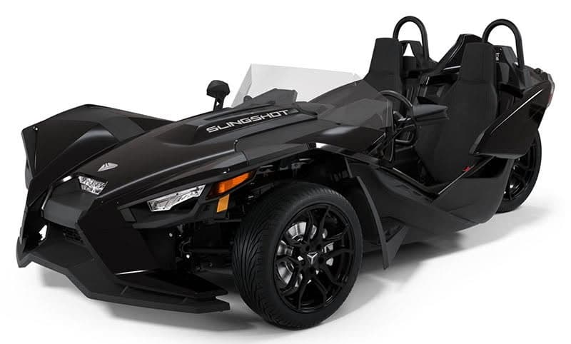 Black Slingshot two-seat roadster studio profile emphasizing front wheel