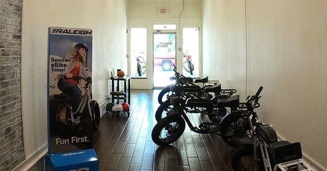 Indoor electric bike showroom with multiple bikes on display