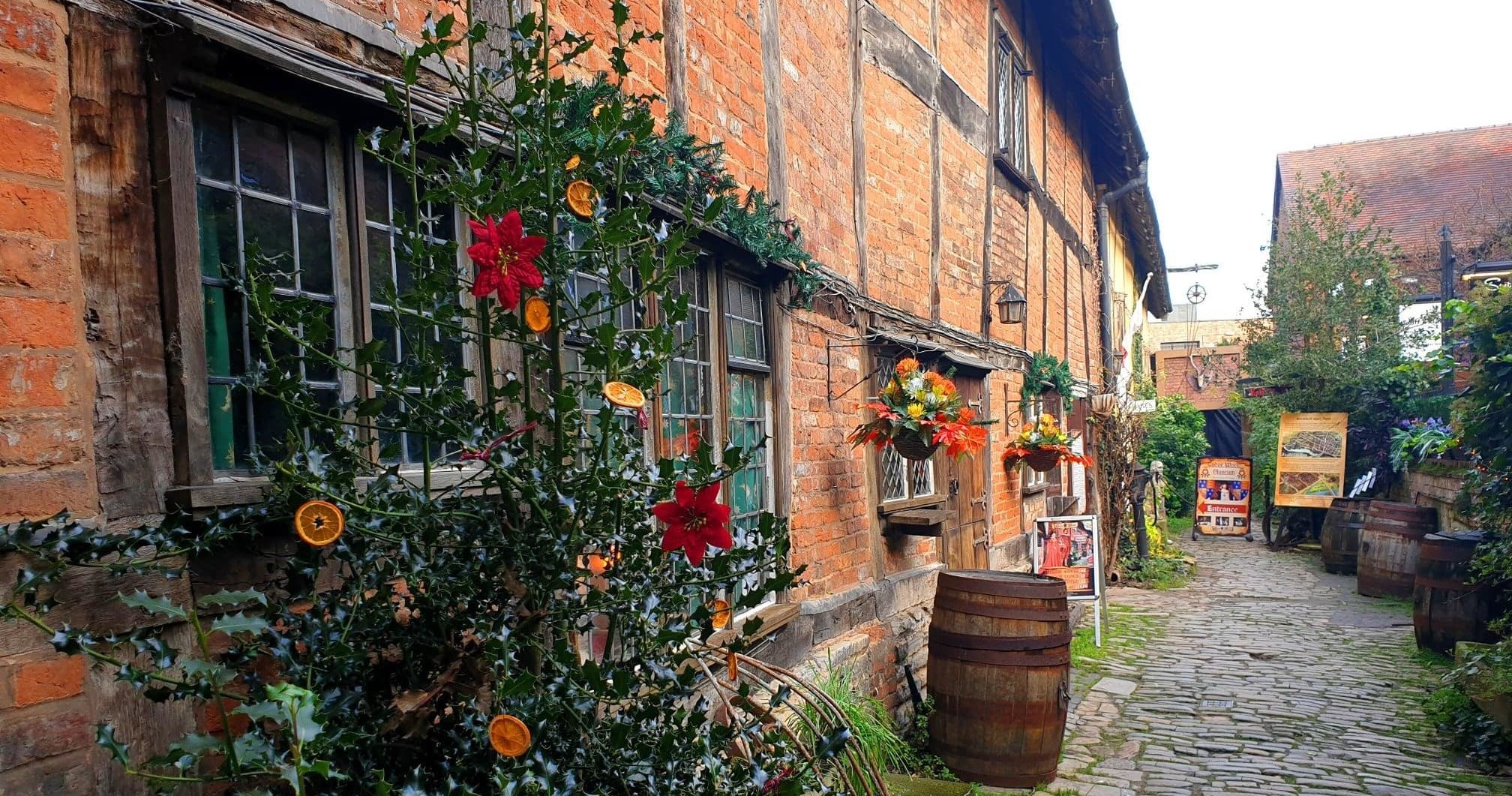 Walking tour through historic Tudor courtyard with cobblestone alley