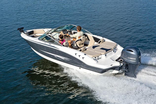 Speedboat cruising over blue Gulf waters with passengers